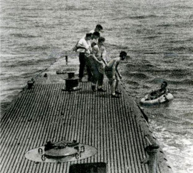 George Bush in a dinghy being rescued after he was shot down in 1944
