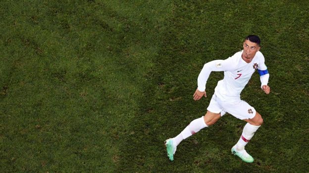 Portugal"s forward Cristiano Ronaldo eyes the ball during the Russia 2018 World Cup round of 16 football match between Uruguay and Portugal at the Fisht Stadium in Sochi on June 30, 2018.