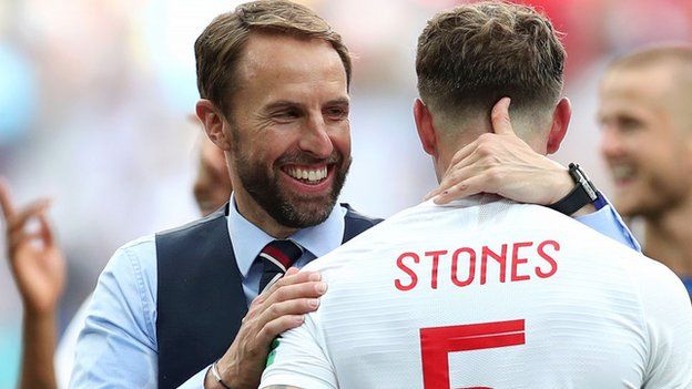England boss Gareth Southgat with defender John Stones