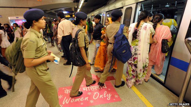 Women boarding a women-only carriage in Delhi, India