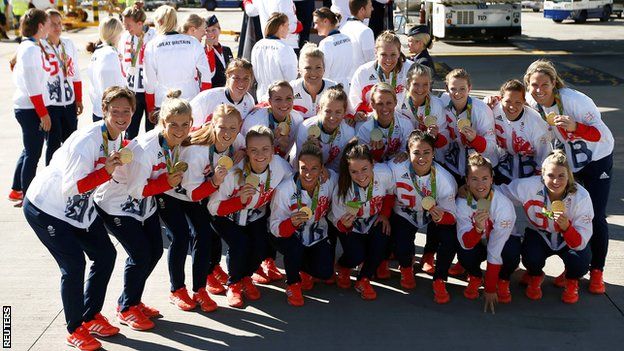 GB's women's hockey team pose with their gold medals