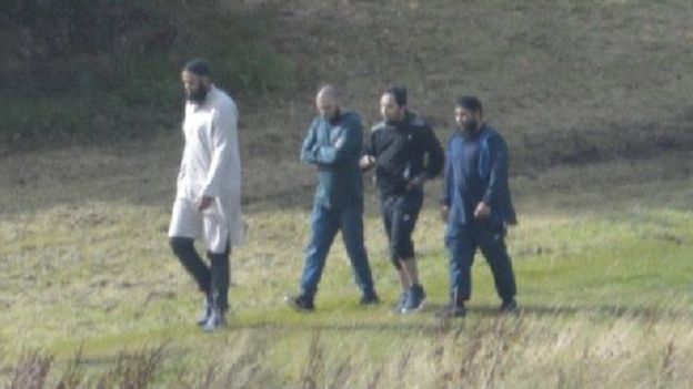 Convert photo of the four men meeting