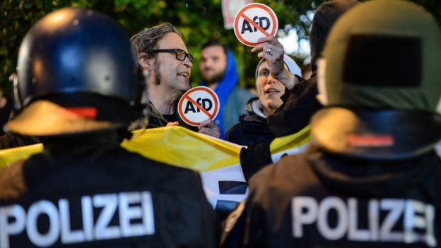 Opponents of the Alternative for Germany (AfD) protest against the result of the AfD