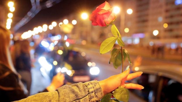 Protester holds a flower in Minsk, Belarus 13 August 2020