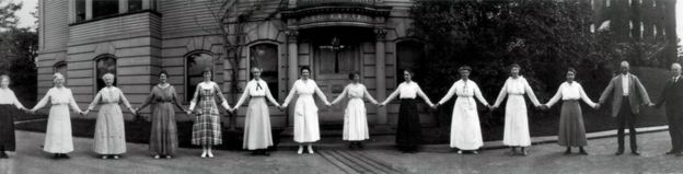A dozen women computers hold hands in this 1918 photograph, which Smith Zrull calls the 