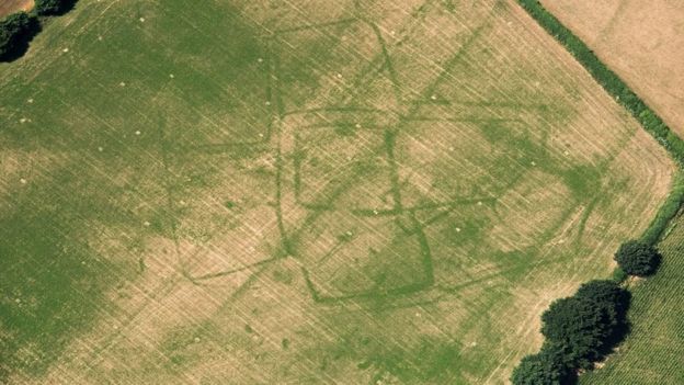 Parch marks of a Roman farm in a field of grass at Bicton, Devon