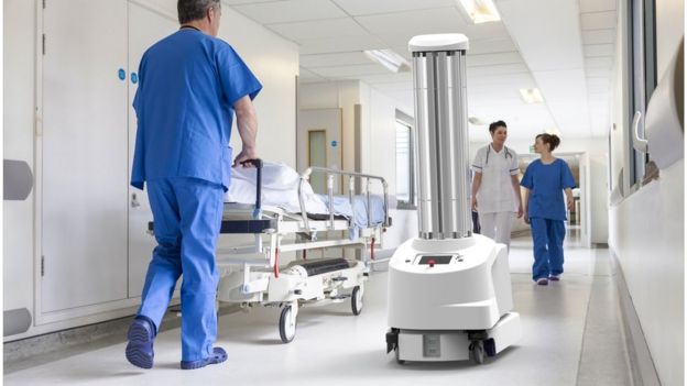 cleaning robots in a hospital hallway