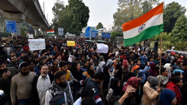 Demonstrators during a protest against the Citizenship Amendment Act (CAA), near Jamia Millia Islamia on December 15, 2019 in New Delhi, India