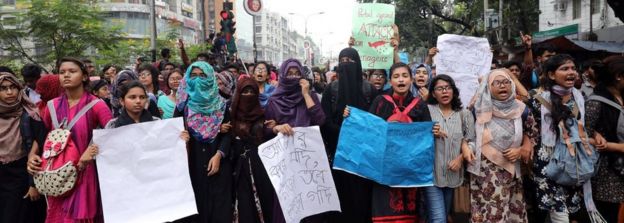 Students shout slogan during a rally as they join in a protest over recent traffic accidents that killed a boy and a girl
