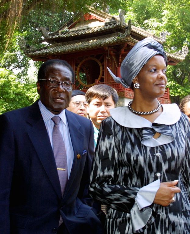 Visiting Zimbabwean President Robert Mugabe and his wife Grace tour the Temple of Litterature in Hanoi, 2001
