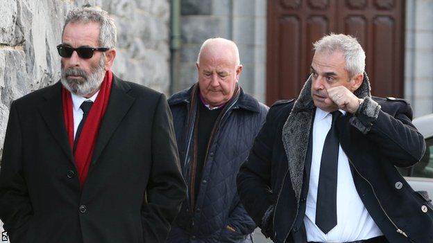 Sam Torrance (left) and Paul McGinley (right) arrives for the funeral of Christy O'Connor Jnr