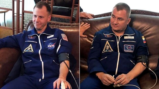 US astronaut Nick Hague and cosmonaut Alexey Ovchinin after landing safely following an incident with their Soyuz rocket, 11 October 2018