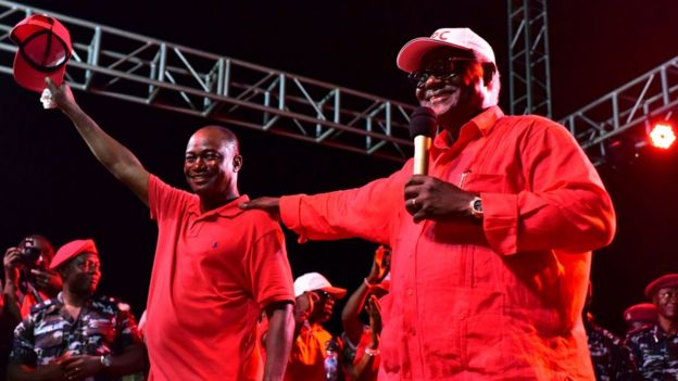 Sierra Leone's outgoing President Ernest Bai Koroma (R) gives a speech during a campaign rally for Samura Kamara (L) on 5 March 2018