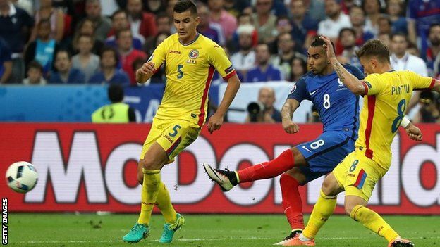 Payet strikes the ball and scores for France