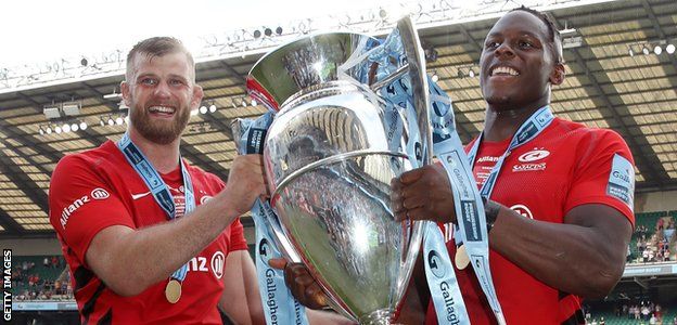 Saracens locks George Kruis and Maro Itoje celebrate with the Premiership trophy
