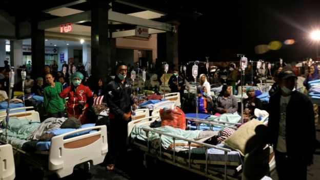 Patients are seen outside a hospital following a strong earthquake on nearby Lombok island, at a government hospital near Denpasar, Bali, Indonesia on 5 August 2018.