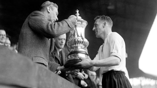 King George VI presents the FA Cup to Derby County captain Jack Nicholas at Wembley in 1946