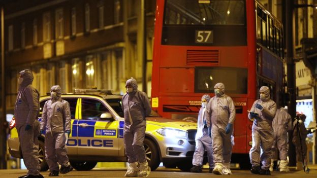 Forensic officers examine the scene where a man was shot and killed by armed police on February 2, 2020 in London, England