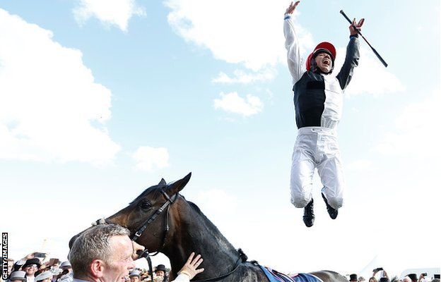 Frankie Dettori performs a flying dismount after winning the Derby on Golden Horn