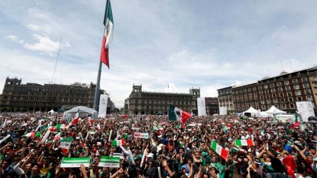 Soccer Football - FIFA World Cup - Group F - Germany v Mexico - Mexico City, Mexico - June 17, 2018 - Mexican fans celebrate at the Zocalo square.