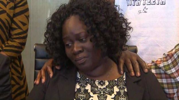 Jordan's mother, Charmaine, silently wept as her lawyers called for the officer's arrest