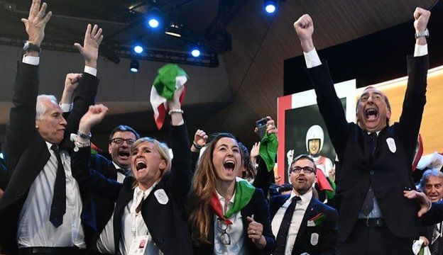 Members of the Italian delegation celebrate Milan-Cortina being named as hosts for the 2026 Games