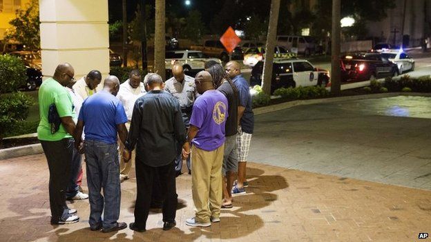 Worshippers pray in Charleston