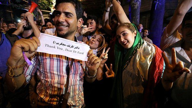 Iranians celebrate after Iran's nuclear negotiating team struck a deal with world powers in Vienna, on 14 July, 2015
