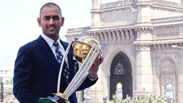 MS Dhoni poses with the 2011 World Cup trophy