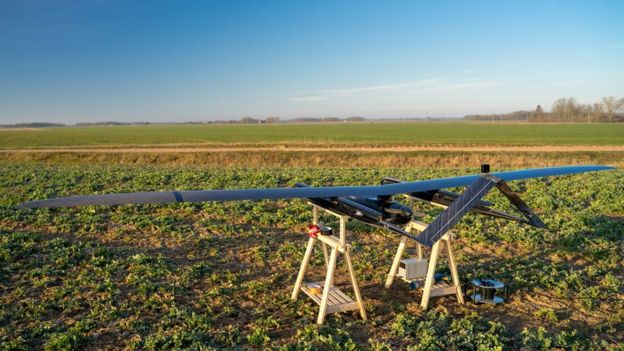 The UAV is seen on a stand in a farmer's field in this photo