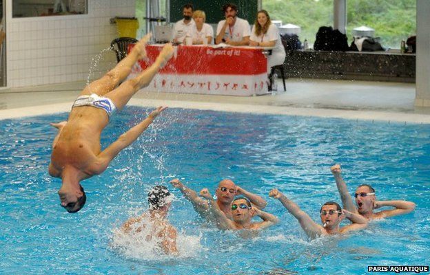 A swimmer being thrown through the air