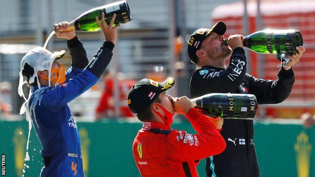 Norris, Leclerc and Bottas celebrate with champagne