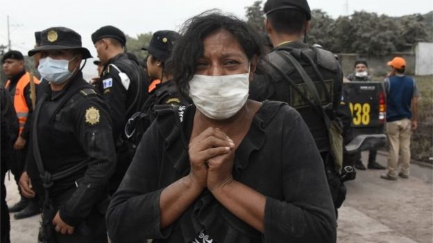 A woman cries for her missing relatives during the search for victims in San Miguel Los Lotes, a village in Escuintla Department, about 35 km southwest of Guatemala City, on June 4, 2018