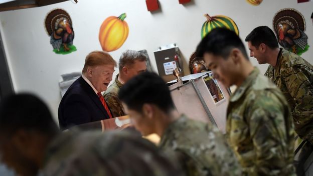 US President Donald Trump serves Thanksgiving dinner to US troops at Bagram Air Field