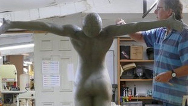 Andrew Sinclair working on one of the three sculptures