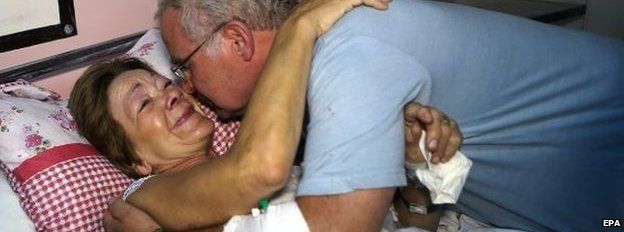 Briton Criss Callaghan (left), 62, who survived the attack, with her husband at a hospital in Sousse
