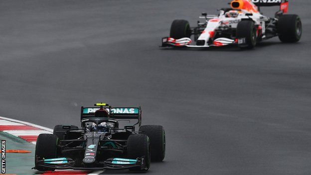 Mercedes driver Valtteri Bottas heads Red Bull's Max Verstappen