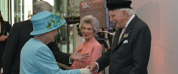 Peter Dimmock shaking hands with the Queen