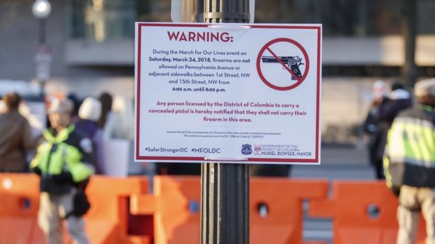 A signs warns people that guns are not allowed on Pennsylvania Avenue , Washington DC