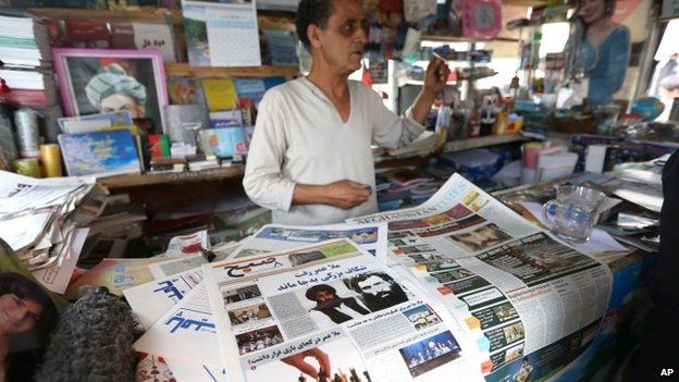 Newspaper seller in Afghanistan