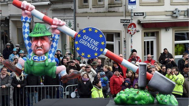 A carnival float, depicting Bavaria"s State Premier Horst Seehofer who tries to close the border.