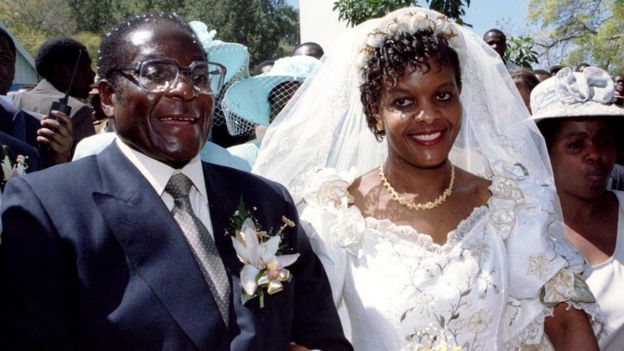 President Robert Mugabe and new wife Grace leave the Kutama Catholic Church in Zimbabwe August 17, 1996 after exchanging their wedding vows.