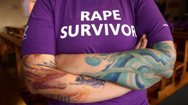 A survivor wearing a rape survivor t-shirt