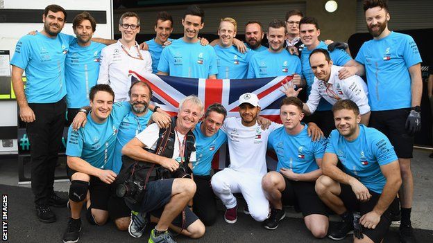 Lewis Hamilton celebrates his fifth world title with his Mercedes team