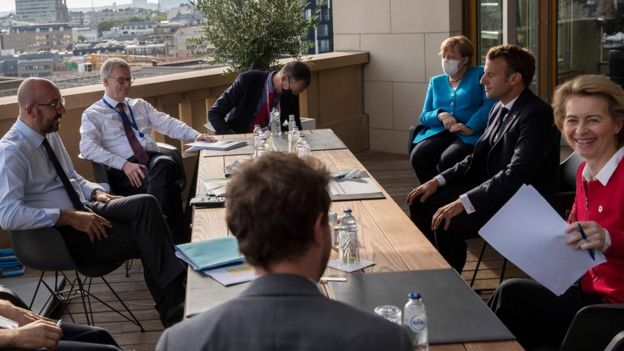 European Council President Charles Michel (L), German Chancellor Angela Merkel (3rd R), French President Emmanuel Macron (2nd R), and European Commission President Ursula von der Leyen (R) meet on the sidelines of an EU summit