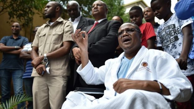 Tanzanian main opposition chief Tundu Lissu gestures from his wheelchair