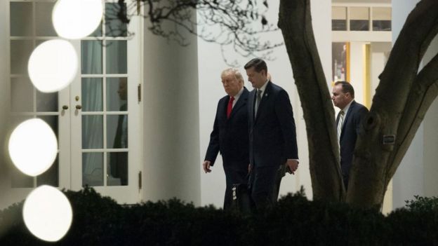 Mr Trump is seen walking with Mr Porter at the White House in December 2017