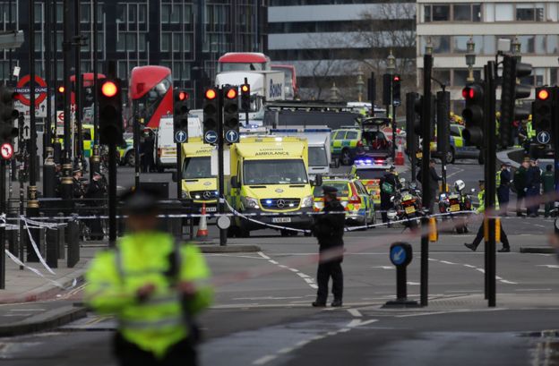 % Searching for the 'angel' who held me on Westminster Bridge Emergency vehicles on Westminster Bridge following the terror attack