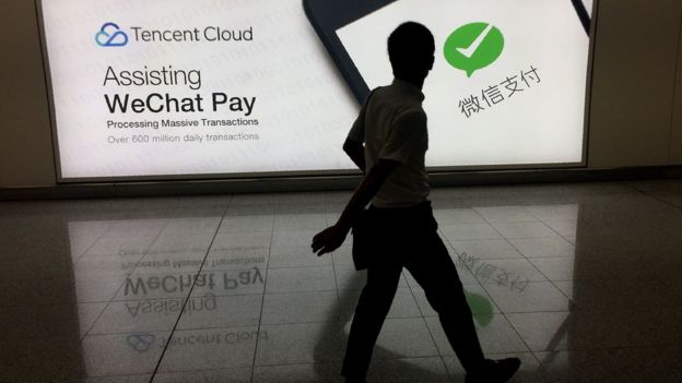 Man walks pay WeChat Pay ad