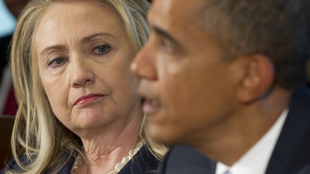 Hillary Clinton looks at Barack Obama during a Cabinet meeting.